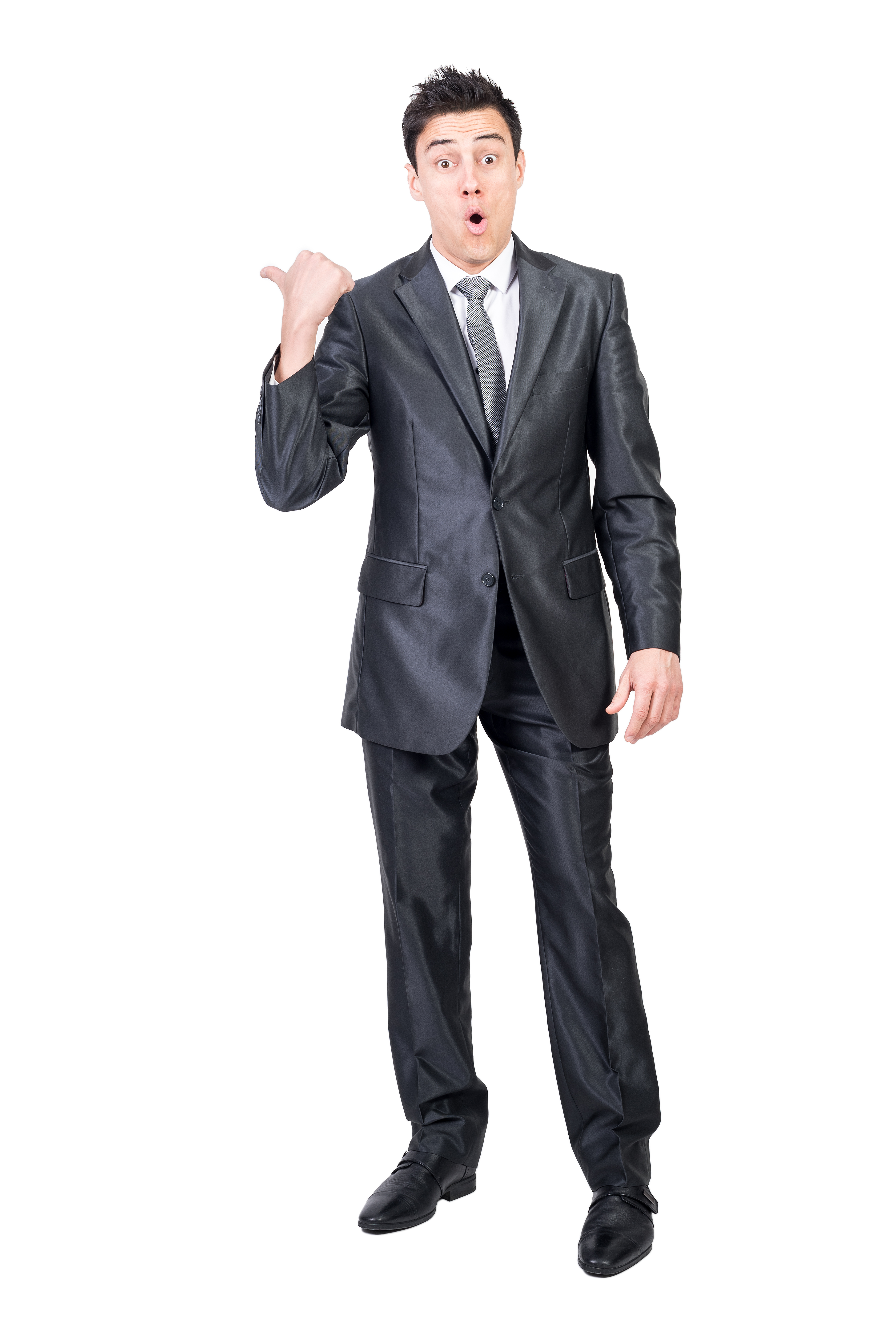 Surprised man pointing aside in studio